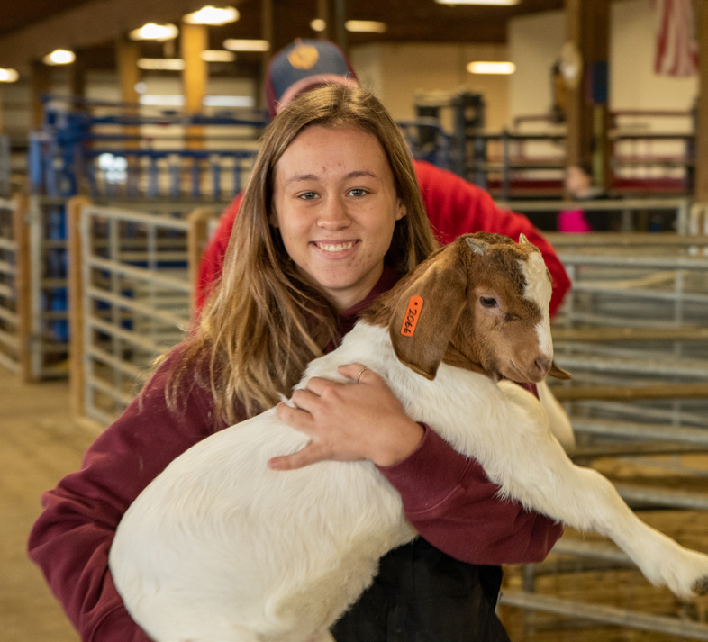 Smiling girl with animal